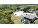 A tranquil scene of a cul-de-sac featuring several homes with screened in pools backing up to scenic green space at 805 Suffolk Pl, Davenport, FL 33896