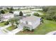 Aerial view capturing a home in a community, near a pond, blending comfort and nature seamlessly at 805 Suffolk Pl, Davenport, FL 33896