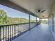 Expansive screened balcony offering ample space and views of the backyard and surrounding trees, perfect for relaxing at 805 Suffolk Pl, Davenport, FL 33896