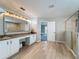 Bright bathroom with a tiled shower, double vanity, and modern fixtures, offering a luxurious space at 805 Suffolk Pl, Davenport, FL 33896