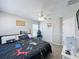 Nicely decorated bedroom features a ceiling fan, closet, and gray walls at 805 Suffolk Pl, Davenport, FL 33896