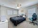 This bedroom is equipped with two windows, and neutral gray walls at 805 Suffolk Pl, Davenport, FL 33896