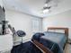 Bright bedroom features soft carpet, a ceiling fan, and a comfortable bed at 805 Suffolk Pl, Davenport, FL 33896