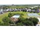 Birds-eye view of pool and tennis courts; community recreational features enhance leisure and social interaction at 805 Suffolk Pl, Davenport, FL 33896
