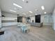 Spacious recreation room with multiple seating and dining areas in a well lit community center at 805 Suffolk Pl, Davenport, FL 33896
