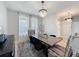Inviting dining room showcasing abundant natural light and stylish decor at 805 Suffolk Pl, Davenport, FL 33896