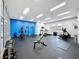 Community fitness center with treadmills, weight machines, and a bright blue accent wall at 805 Suffolk Pl, Davenport, FL 33896