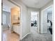 Hallway leading to bathroom and bedroom offering convenient access to amenities at 805 Suffolk Pl, Davenport, FL 33896