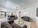 Open concept living room featuring modern decor, neutral paint, and plenty of seating at 805 Suffolk Pl, Davenport, FL 33896
