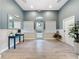Inviting lobby with stylish decor, a blue accent wall, and ample natural light at 805 Suffolk Pl, Davenport, FL 33896