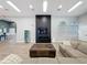 Stylish lounge area boasting a sleek entertainment center, spacious seating, and contemporary design at 805 Suffolk Pl, Davenport, FL 33896