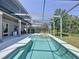 Relaxing screened-in pool area with lounge chairs, outdoor grill, and well-maintained patio, perfect for entertaining at 805 Suffolk Pl, Davenport, FL 33896