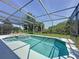 Relaxing screened-in pool area with lounge chairs, outdoor grill, and well-maintained patio, perfect for entertaining at 805 Suffolk Pl, Davenport, FL 33896