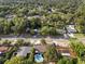 Aerial view features a lovely home with a backyard pool, situated in a lush, green neighborhood at 807 E Airport Blvd, Sanford, FL 32773
