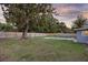 Fenced backyard with an in-ground pool and ample green space at 807 E Airport Blvd, Sanford, FL 32773