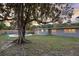 Large backyard with an in-ground pool and a mature shade tree at 807 E Airport Blvd, Sanford, FL 32773