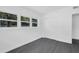 Bright bedroom features gray laminate flooring, a closet, and lots of natural light at 807 E Airport Blvd, Sanford, FL 32773