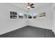 Bright bedroom featuring gray laminate flooring, and lots of windows for natural light at 807 E Airport Blvd, Sanford, FL 32773