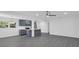 Open concept kitchen featuring an island, stainless appliances, and seamless flow into the large living area at 807 E Airport Blvd, Sanford, FL 32773