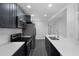 Modern kitchen features gray cabinets, stainless steel appliances, and a spacious countertop at 807 E Airport Blvd, Sanford, FL 32773