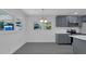 Bright kitchen area with stainless appliances, shaker cabinets, and a large window with natural light at 807 E Airport Blvd, Sanford, FL 32773