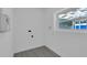 Unfinished laundry room with hookups, neutral paint, wood-look floor, and natural light at 807 E Airport Blvd, Sanford, FL 32773