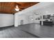 Open-concept living room with a kitchen, ceiling fans, and wood ceiling at 807 E Airport Blvd, Sanford, FL 32773