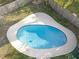 Aerial close up of in-ground pool with ladder and poolside surface at 807 E Airport Blvd, Sanford, FL 32773