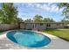 Backyard pool with a light concrete patio and exterior view of the home at 807 E Airport Blvd, Sanford, FL 32773