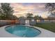 Backyard pool with access to the house and surrounding green space at 807 E Airport Blvd, Sanford, FL 32773