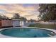 Backyard pool with access to the house and surrounding green space at 807 E Airport Blvd, Sanford, FL 32773
