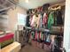 Organized walk-in closet with ample storage for clothes, shoes, and accessories at 921 Spring Palms Loop, Orlando, FL 32828