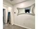 Hallway featuring modern mirrors and tile flooring, creating an open feel at 921 Spring Palms Loop, Orlando, FL 32828