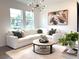 Well-lit living room features a white sofa, round coffee table, modern light fixture, and neutral decor at 921 Spring Palms Loop, Orlando, FL 32828