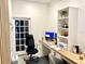 A home office is equipped with a desk, shelving and an ergonomic chair for comfortable working from home at 921 Spring Palms Loop, Orlando, FL 32828