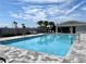 Refreshing community pool featuring lounge chairs and clear blue water for relaxation and enjoyment at 921 Spring Palms Loop, Orlando, FL 32828