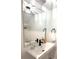 Minimalist powder room with a vessel sink, modern faucet, and decorative mirror at 921 Spring Palms Loop, Orlando, FL 32828
