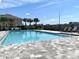Community pool featuring ample space, lounge chairs, and well-maintained surrounding areas at 921 Spring Palms Loop, Orlando, FL 32828