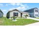 Well-maintained home featuring a green lawn with decorative rock and a two-car garage at 1139 Seedorf Dr, Winter Haven, FL 33881