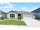 Charming single-story home featuring a well-manicured lawn and a two-car garage at 1139 Seedorf Dr, Winter Haven, FL 33881