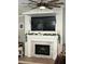 Living room fireplace with shiplap, mounted TV, and decorative mantle at 1139 Seedorf Dr, Winter Haven, FL 33881