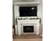 Living room fireplace with shiplap, mounted TV, and decorative mantle at 1139 Seedorf Dr, Winter Haven, FL 33881