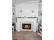 Close up of the fireplace featuring a white mantle and decorative tile at 1139 Seedorf Dr, Winter Haven, FL 33881