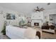 Inviting living room featuring a fireplace and large window with ample natural light at 1139 Seedorf Dr, Winter Haven, FL 33881