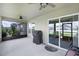 Covered patio featuring ceiling fans, outdoor seating, and a grill at 1139 Seedorf Dr, Winter Haven, FL 33881
