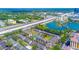 Wide aerial shot of the condo community near a lake, highway, and commercial district at 115 Oyster Bay Byu # 115, Altamonte Springs, FL 32701