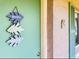 Close-up of a charming condo entrance with a decorative welcome sign at 115 Oyster Bay Byu # 115, Altamonte Springs, FL 32701