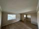 Spacious living area with neutral walls and wood-look floors at 115 Oyster Bay Byu # 115, Altamonte Springs, FL 32701