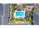 Aerial view of a community pool with lounge chairs and shaded seating areas surrounded by lush landscaping at 115 Oyster Bay Byu # 115, Altamonte Springs, FL 32701
