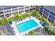 Community swimming pool area with lounge chairs, umbrellas, and mature landscaping surrounding the pool at 115 Oyster Bay Byu # 115, Altamonte Springs, FL 32701
